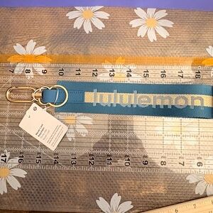 Lululemon Teal and Gold Logo Never Lost Keychain